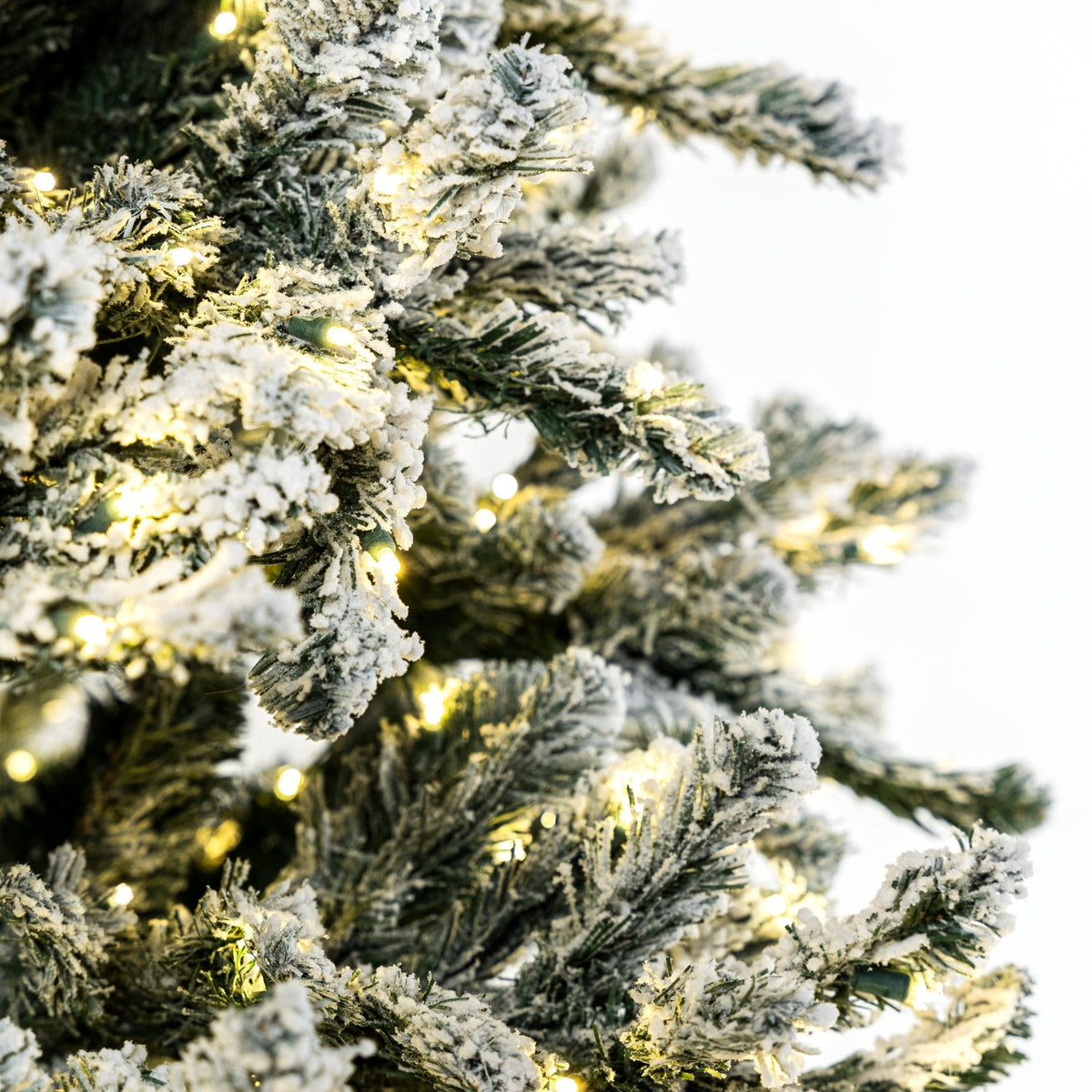 Joy By 7.5' Flocked Christmas tree with 700 Warm White LED Lights