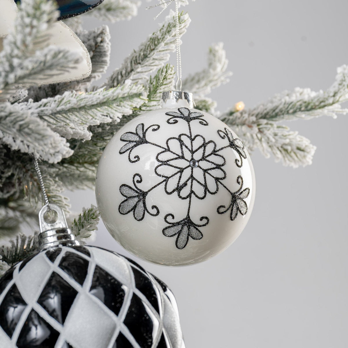 White Ball Ornament with Black Glitter Floral Detail